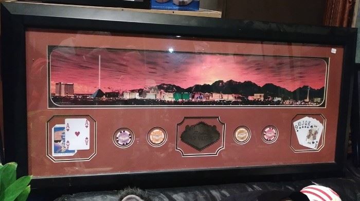 Large Las Vegas framed picture with poker chips and cards in the framing 