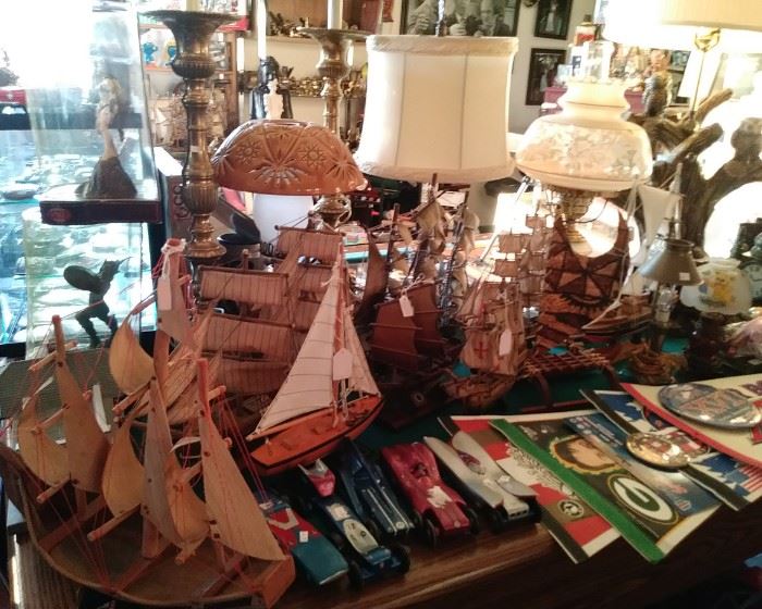 Assorted model ships and decorative lamps