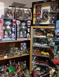 Assorted collector glass and mugs...Dragon and wizard figures....Action figures....Android robots....and more