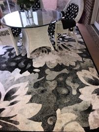 7 - PIECE WICKER ARMCHAIRS AND ROUND TABLE GLASS TOP