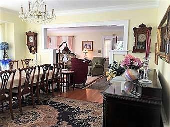 Double pedestal Sheridan dining room table with 12 Chippendale style chairs