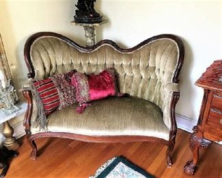 One of two Victorian style settees