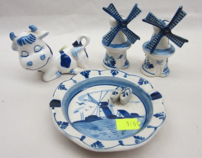 THREE PIECES OF DELFT POTTERY: SALT & PEPPER SHAKERS IN THE FORM OF WINDMILLS, COW, AND ASHTRAY