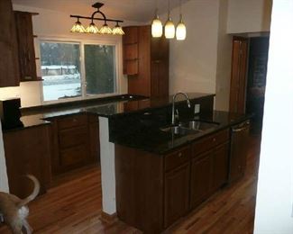 The Thomasville Kitchen Cabinets with Palomino stain finish. The Kitchen Cabinets were installed July of 2017, so they are like new. The cost of cabinets alone were are over $20,000 plus another $4,700 for the Granite. Will have bill of sale at the sale for proof. The set is in excellent condition. In the sale the Island is included.