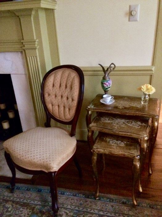 One of the antique gold silk slipper chairs and gold nesting tables!