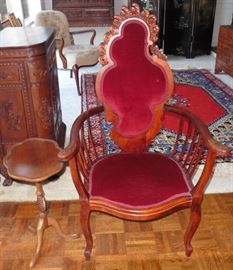 Red velvet upholstered chair. 