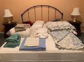 King size bed in great condition, headboard, various blankets, sheets, and pillows