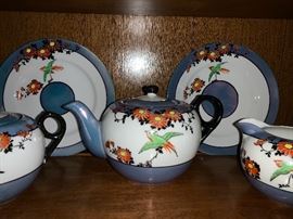 Antique tea set from Japan.  Include teapot, sugar bowl, creamer, 4 cups and saucers and 4 dessert plates