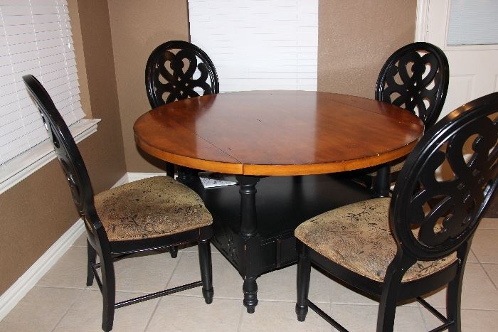 Two tone red oak table with 4 pierce back upholstered chairs