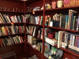 large assortment of cookbooks, candlesticks