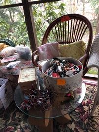 glass top table, Papasan chair, vintage c-7 strand of Christmas lights, toys