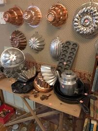 various molds, cast iron skillets, vintage coffee pot