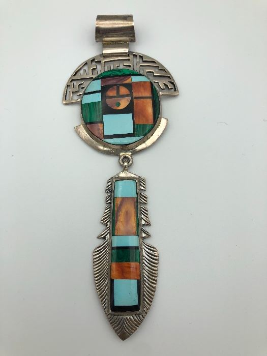 Item Number P97. Large Navajo sterling Pendant signed "Sterling Frank Yellowhorse".  Measures just over 5 1/2" long. 