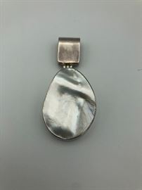 Item Number P22. Sterling silver (marked 925) surrounding shell. Measures 2 1/4". 