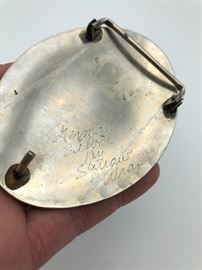 Item Number M 86- Marked "German Silver by Squaw Wrap". Measures just over 3 1/2" across. 