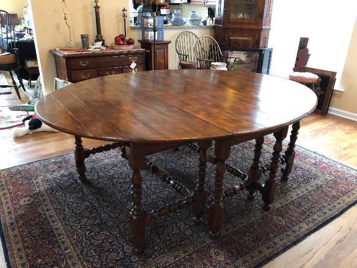 Theodore Alexander Gate Leg Table. When fully extended table is 81" long. 63" at widest point. When both drop leaves are down table is only 24.5" wide. Beautiful condition. 