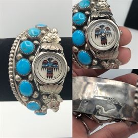 Item Number W11. Rain Clouds Watch. Signed "...son Lee". Sterling silver band with 7 turquoise. stones. You can replace the watch face. 