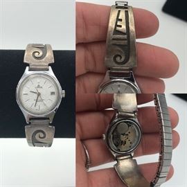 Item Number W63.  Lorus watch is missing back. Sterling sides. 