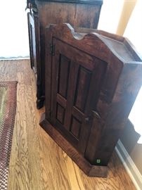 This corner cabinet is actually upside down because of the way the base is shaped. It measures 31” tall. 24.5” wide  and front to back is 11.5”. 