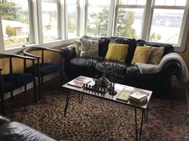 Contemporary Side Chairs (3), Comfy Distressed Leather Sofa, Contemporary Coffee Table, Menorahs and Hanukka Literature, Large Karastan Area Rug.