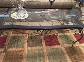 Iron Scroll Coffee Table with Leather Trim
Pretty Woven Area Rug from Pottery Barn
