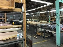 Fabric by the roll, or by the pallet!  You choose!  Also shown in this photo are cutting tables that are available!