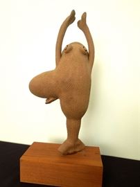 Lot 218: Terracotta Dancing Frog Statue on Wood Base 
by Asheville artist Verdelle Gray (1918-2015). This is from the 1970's. Her early background in ballet prompted her to produce a "dancing Frog" from clay, and she later became know as the "Frog Lady" at craft fairs. Verdelle's work has been exhibited all over the county, and as far away as Belgium and India. Verdelle, as well as her clay artistry, will long be remembered. On solid wood base. Signed . Fog is 14" H. Base is 6.5" W x 3" H From living estate of Charles Rathbun.
