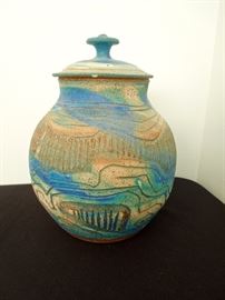 Lot 219: Charles Counts Vintage Art Studio Pottery Scored Covered Vessel
Beautiful sample of 1970's southern studio art pottery by Charles counts of Rising Fawn studios. Vivid turquoise and peacock blue matt glaze over stoneware. Scored bauhaus design. 9.5" H x 7.5" W. No chips or cracks. Living estate of Charles Rathbun.
