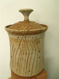 Lot 220: Art Studio Piece: Owens Stoneware Covered Vessel. Fine example of milk glaze scored 1970's NC pottery. Signed "Owens 1978". Not stamped. 8" H x 6" W. No cracks, chips or kiln marks. From living estate of Charles Rathbun.