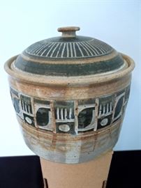 Lot 272: Two 1970's Studio Pottery Pieces by Michael Pitts
The stoneware 8" covered crock is a beautiful example of Pitt's work. It is signed and dated 1975 and scored and painted with a geometric bauhaus style design. The circular design bowl is painted on and 6.5" wide overall. It is also signed and dated 1975. No chips, cracks or kiln errors noted. The covered crock is larger than other pieces of Southern Studio Pottery being sold Michaell Pitts is from Watkinsville, GA and is living, but currently lecturers and no longer produces pottery. He has produced many sought after and not often offered for sale pieces of pottery. From living estate of Charles Rathbun.