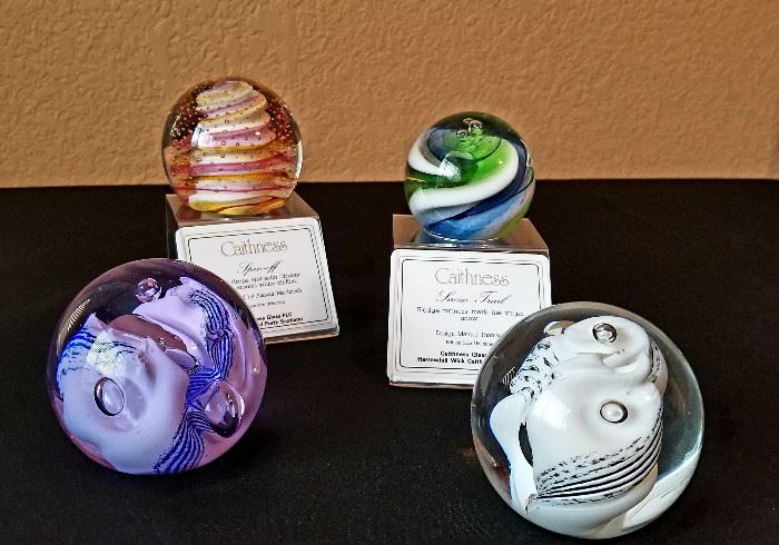 Caithness paperweights. Prices range from $30 (unlimited edition) to $40 (limted edition). Includes original boxes.