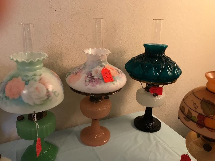 Aladdin lamps, some with hand painted shades