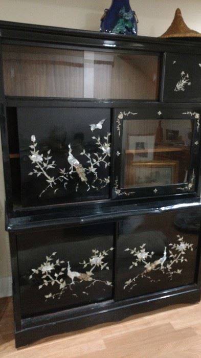 Black lacquer cabinet with sliding doors