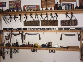 old license plates and tools and oil cans