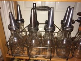 old oil cans and holder
