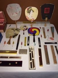 collection of fans and chopsticks