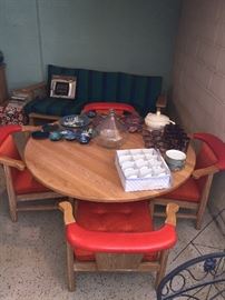 Brandt Ranch Oak game table/dining table with orange chairs