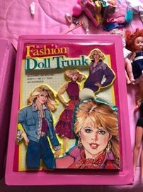 Barbie dolls, clothes and 2 cases