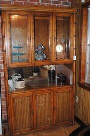 Lighted rattan style china cabinet
