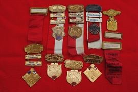 Medals and name tags from conventions of the Sons of Confederate Veterans from the 1930s and 40s.