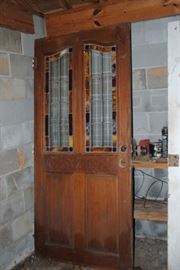 solid wood door with carving and stain glass