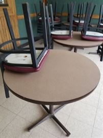 Assorted laminate top round tables with heavy metal pedestal bases $50 each (4) 34" (1) 30" Black metal ladder back chairs with burgundy vinyl seats $45 per chair (10) available