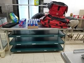 73" x 30" Stainless steel table with stainless steel over shelf, 3 green painted steel under shelves & stainless steel legs $150