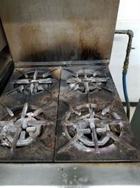 US Range 24" stainless steel gas 4 burner stove with working stainless steel under oven & stainless steel over shelf $495