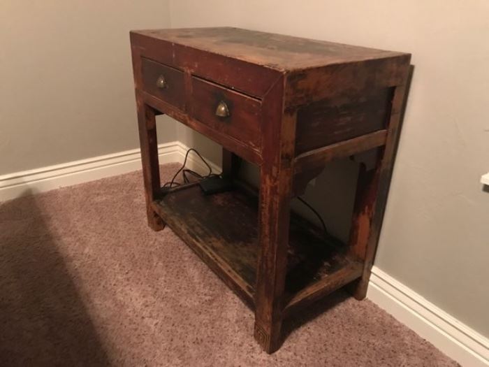 Antique, worn wood table with drawers 