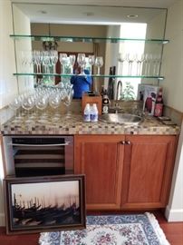 Loads of wine glasses and bar accessories