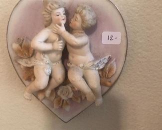 Pair of ceramic cupids