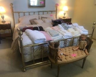 King size brass bed with matching White Furniture Co. French Provincial night stands and vintage lamps