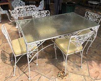 Vintage metal/glass top wrought iron patio table and 4 chairs