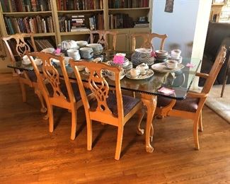 Beautiful glass table with 6 Chippendale chairs